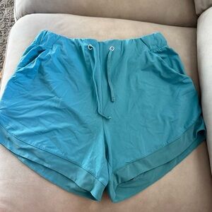 Blue workout shorts with pockets